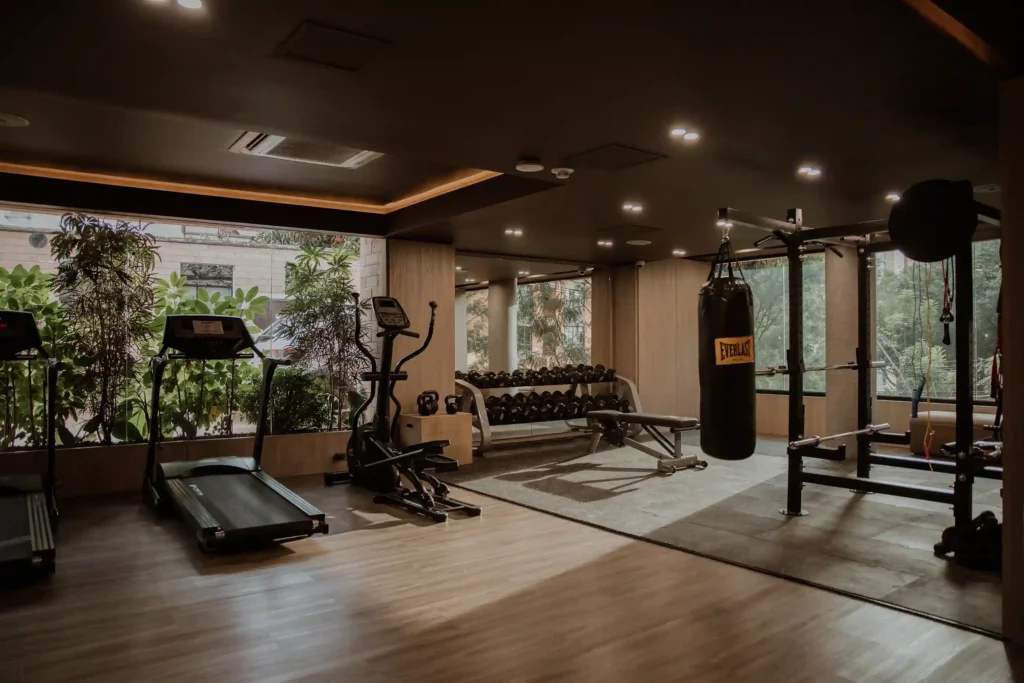 BINN Hotel gym with treadmill, dumbbells and punching bag in El Poblado.