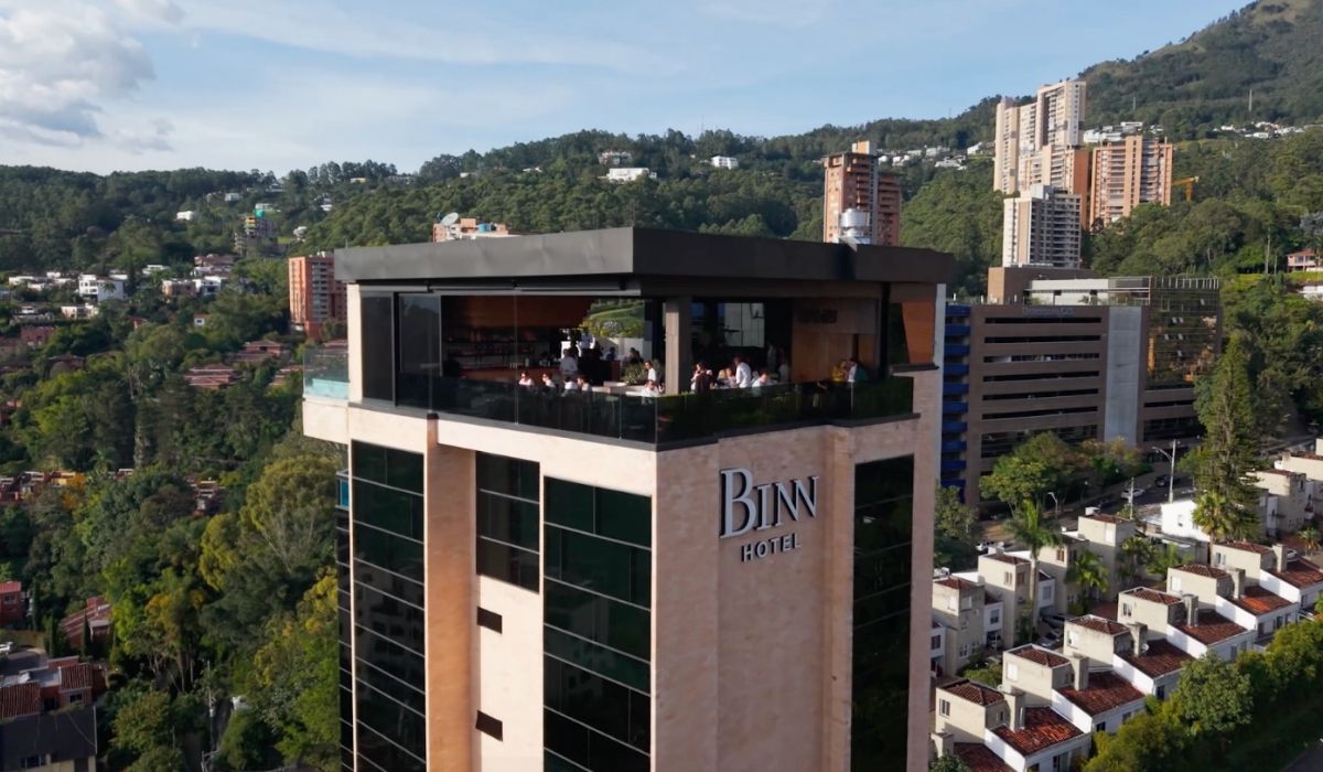 Perspective of the hotel from the roof, revealing its structure and the surrounding area.