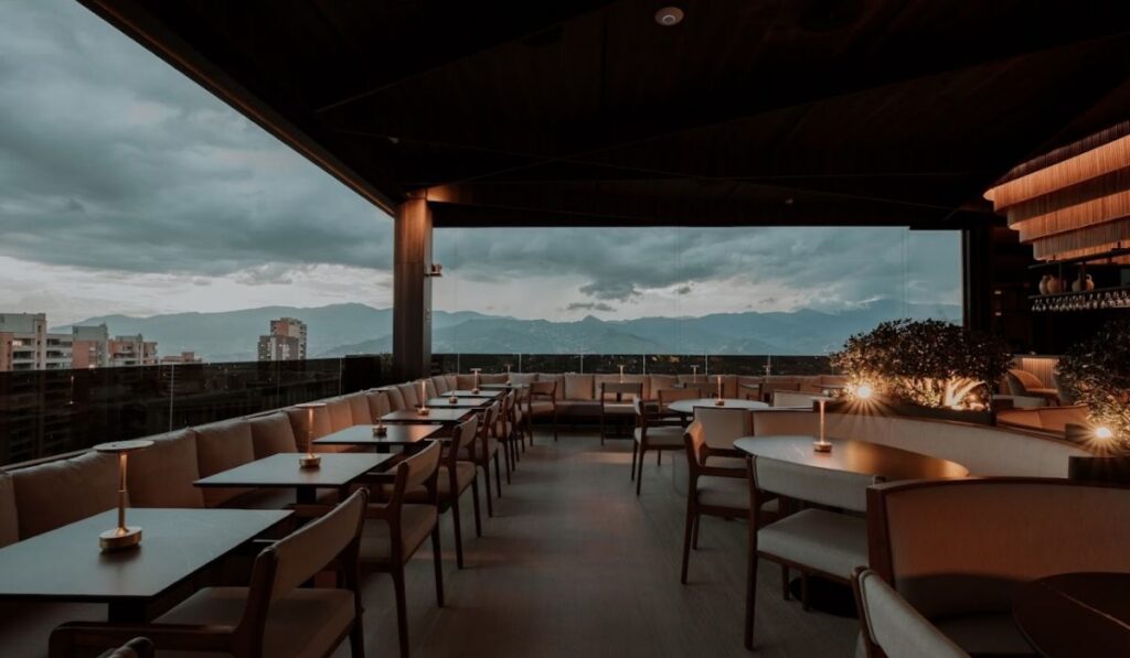 etro rooftop illuminated at night, with soft lights that create a cozy and elegant atmosphere.