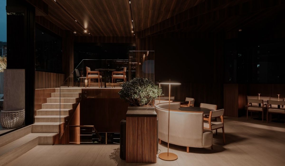 Etro rooftop features wooden floors and a staircase, contributing to its cozy and stylish atmosphere.