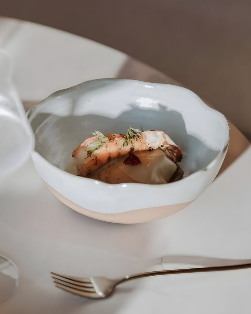 A white bowl containing a gluten-free saucer.