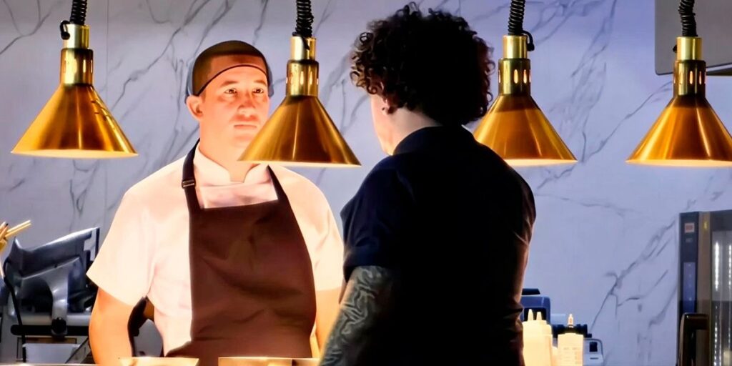 Cocineros trabajando en cocina profesional con iluminación cálida en restaurante de gastronomía sostenible en Colombia