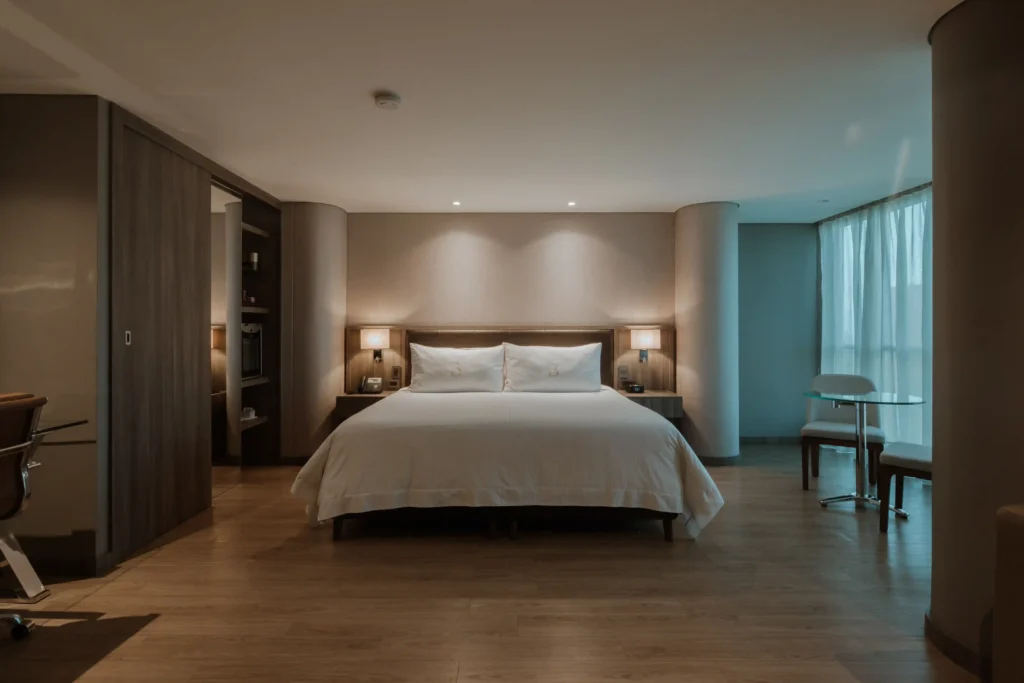 BINN Hotel Junior Suite Deluxe with king bed, hardwood floor and warm ambient lighting