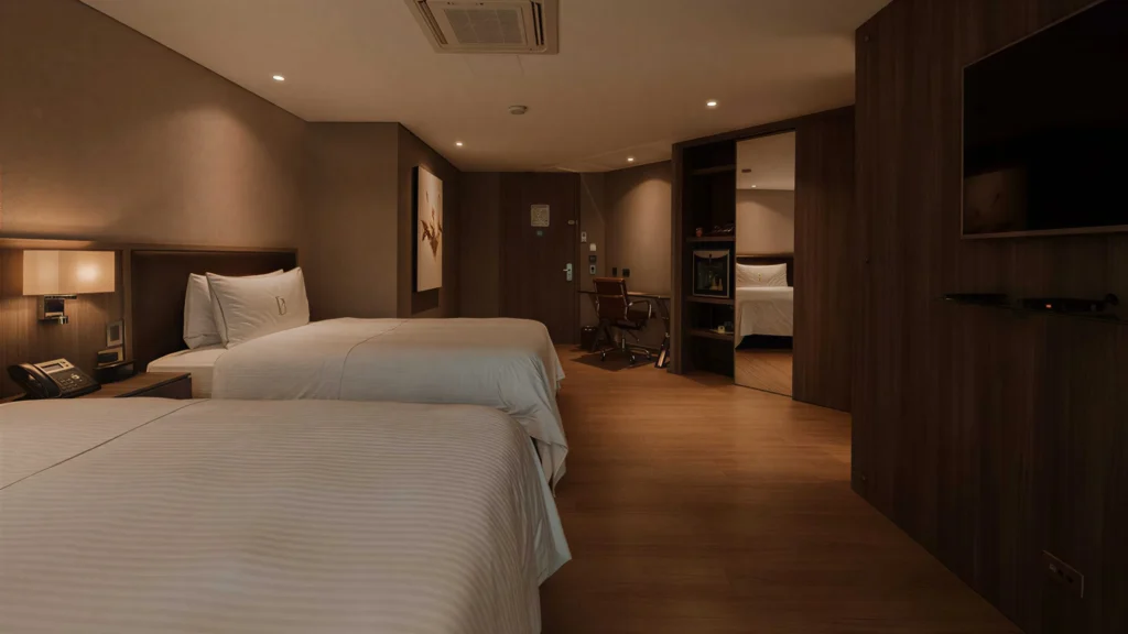 Superior Twin room at BINN Hotel with two beds and hardwood floor.