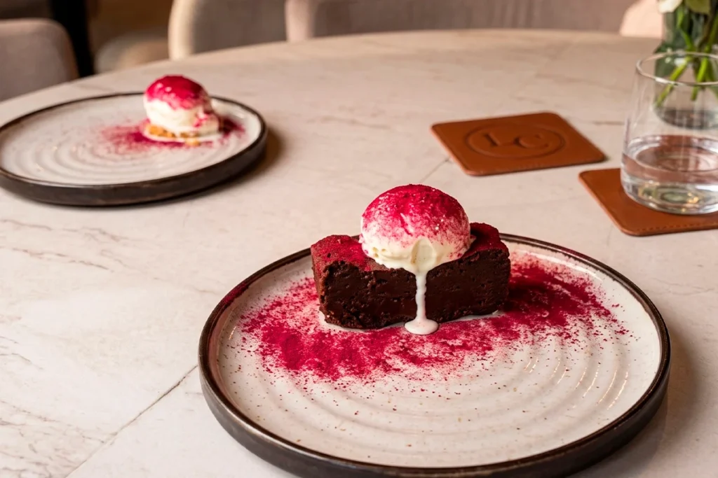 La Makha dessert: chocolate cake with ice cream and red fruit dust