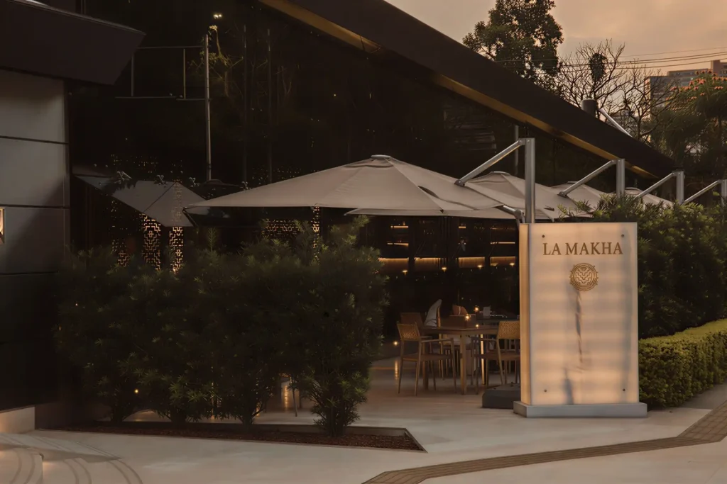 Illuminated entrance and terrace of La Makha Restaurant for luxury executive dining in El Poblado.