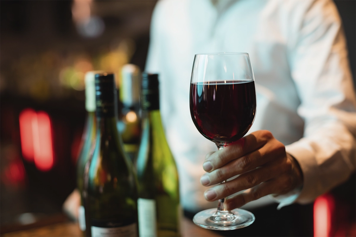 Glass of red wine served at La Makha restaurant in Medellín