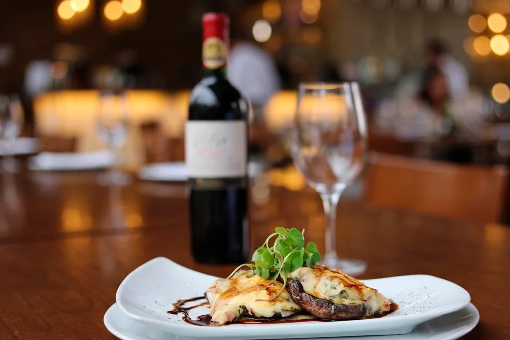 Red wine paired with a dish from La Makha's menu in Medellín