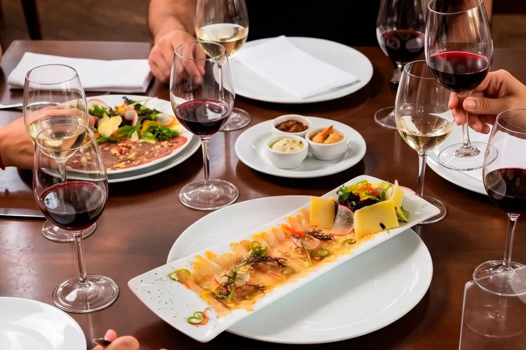 Red and white wine pairing with ceviche and sharing plates at Etro Rooftop.