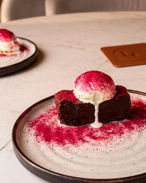 La Makha dessert: chocolate cake with ice cream and red fruit dust
