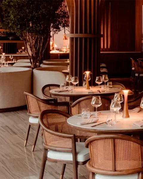 La Makha dining room atmosphere with warm lighting for booking in Medellín