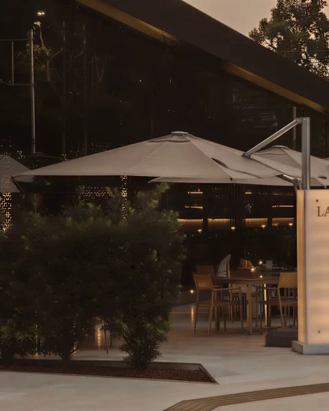 Illuminated entrance and terrace of La Makha Restaurant for luxury executive dining in El Poblado.